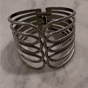 Pretty hinged silver tone cuff style bracelet